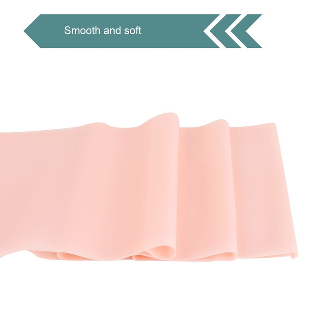 A smooth and soft pink fitness resistance band, displayed in folds, with a logo present.