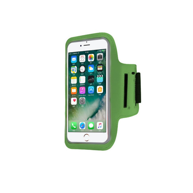 A green arm band designed to hold a smartphone, featuring a transparent touchscreen cover and adjustable strap.