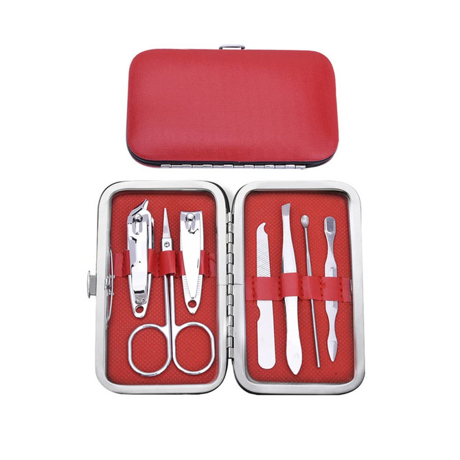 A stylish manicure set in a red case features silver tools, including scissors, clippers, and pushers.