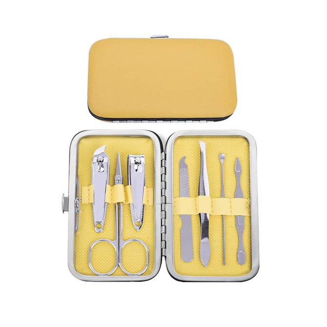 A stylish manicure set featuring stainless steel tools in a yellow case, including scissors, clippers, and nail files.