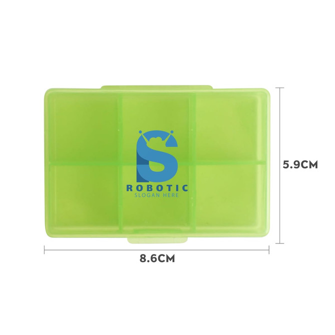 A green square pill box with six compartments, featuring a logo on the surface. Dimensions are 8.6cm x 5.9cm.