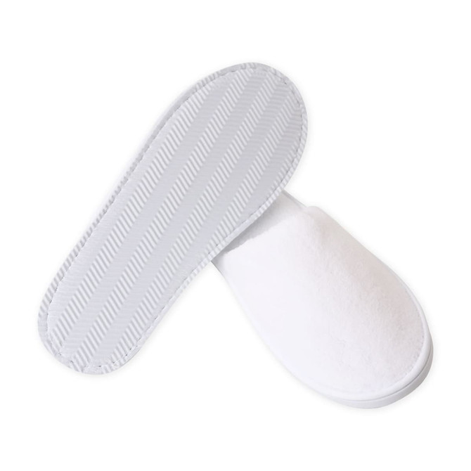 White hotel slippers with a soft fabric exterior and textured rubber soles, featuring a simple design and a logo.