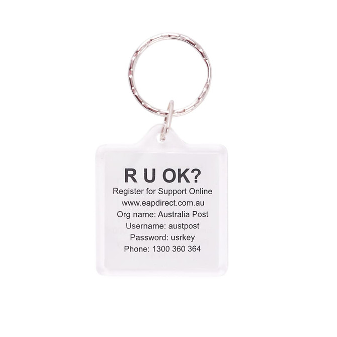 A square acrylic keyring with a clear design and a metal ring, featuring printed text and a logo.