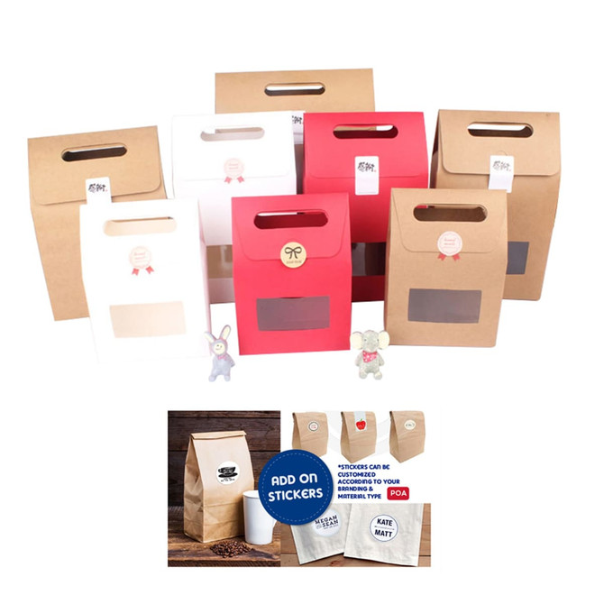 A variety of die cut handle bags in red, white, and brown, featuring windows and handle openings, with some branding.