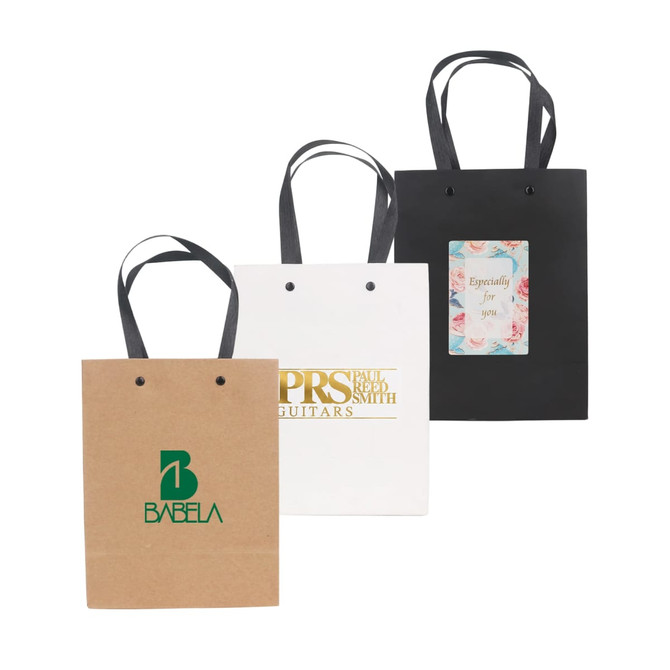 Three paper bags in brown, white, and black, each featuring handles and a logo or design on the front.
