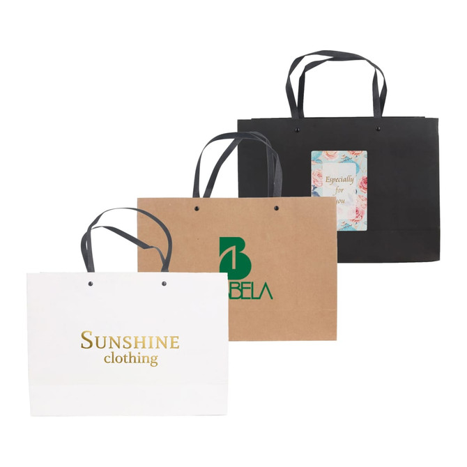 Large crosswise paper bags in white, brown, and black, featuring knitted handles and various designs and logos.