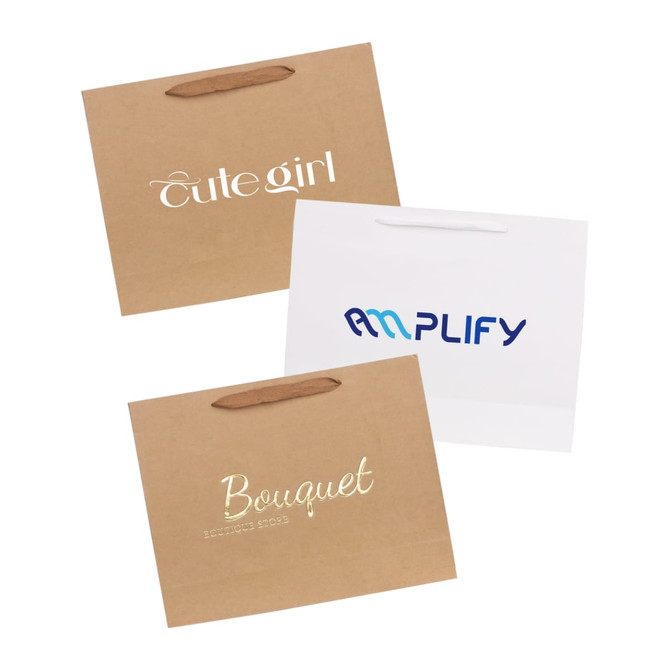Three large brown paper bags with fabric flat handles, featuring various logos and designs in white and blue.