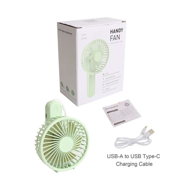 A foldable USB handy fan in light green, with a USB charging cable and packaging in the background.