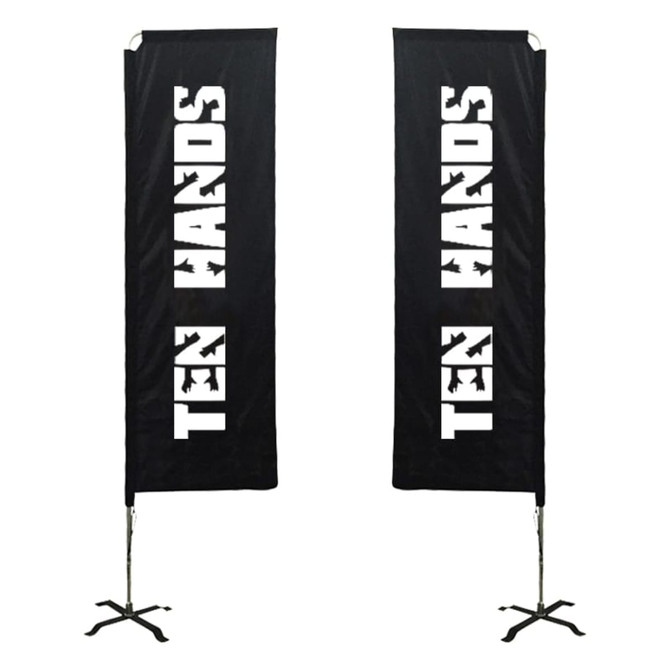 Two large rectangular banners in black with a logo. They are mounted on stands.
