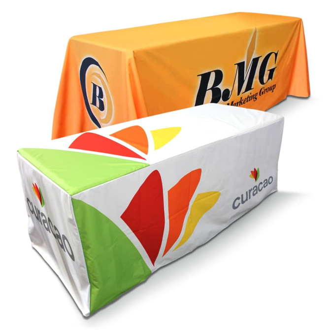 Two fitted tablecloths displayed, one in vibrant orange with a logo and the other in white with a multi-coloured design.