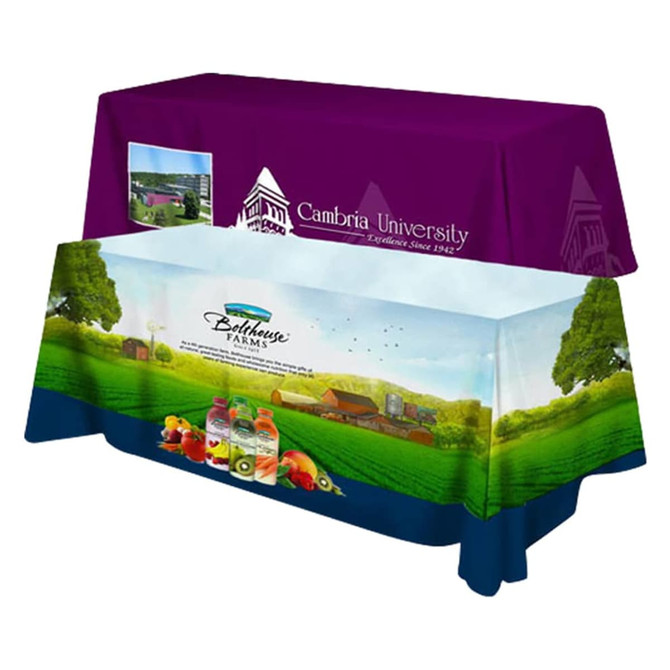 A 4-sided throw tablecloth in purple and blue featuring graphics of farmland and beverages, with a logo.