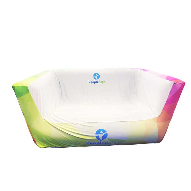 An inflatable two-seat sofa in vibrant gradient colours with a logo on the front.