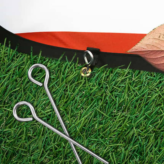 An oval-shaped pop-up banner with a grass-like base, featuring attachment hooks and pegs.