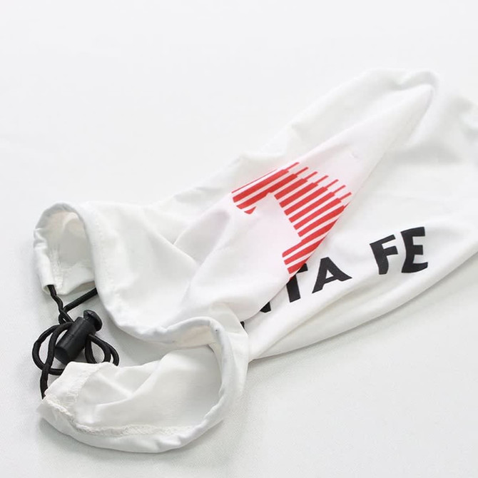 A white car mirror cover with a drawstring, featuring a red and black logo.