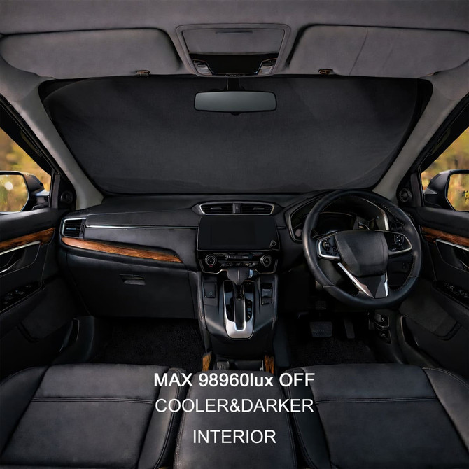 A black reflective car sunshade positioned in a vehicle's dashboard, showcasing a sleek interior design.