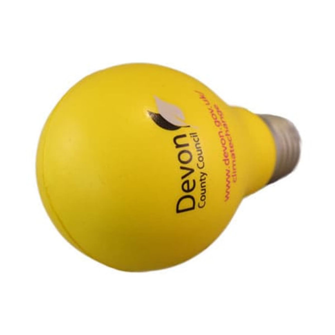 A yellow bulb-shaped stress reliever with a silver base and a logo on one side.