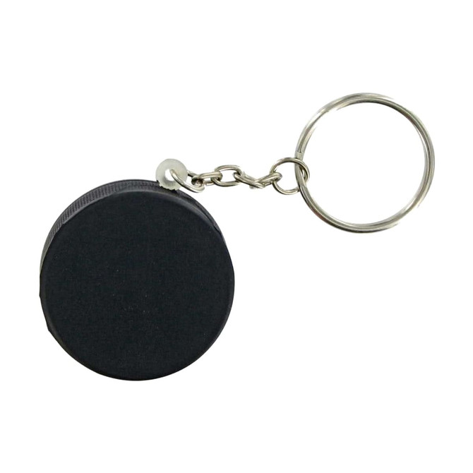 A keyring featuring a black hockey puck stress reliever with a metal chain attached.
