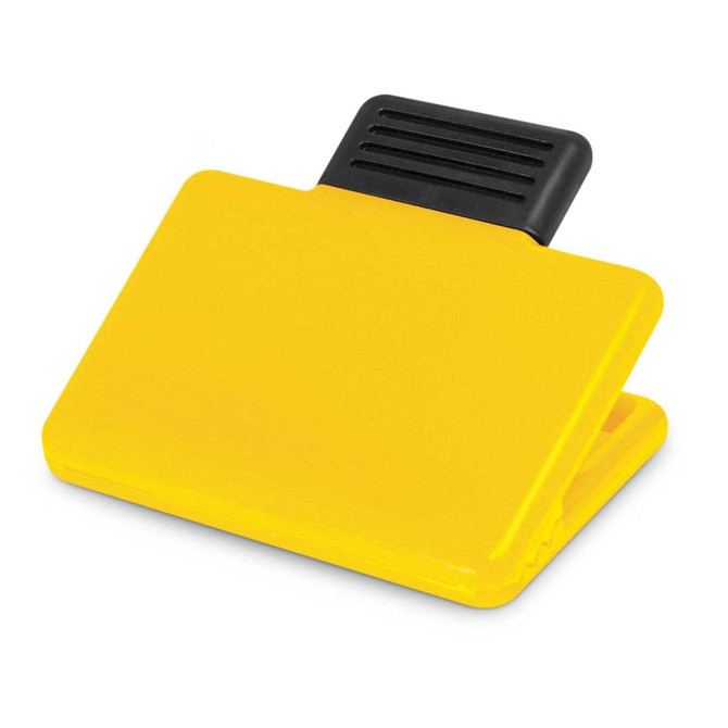 A yellow Pronto Magnetic Clip with a black grip on top, designed for holding papers or notes.