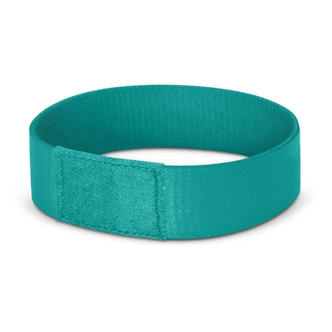 A teal Dazzler Wrist Band designed for events, featuring a simple, smooth texture and a secure fastening.