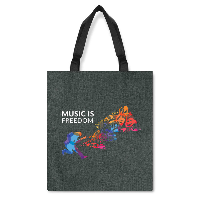 A dark grey tote bag featuring a colourful graphic of musicians and the phrase "Music is Freedom." It has black handles.