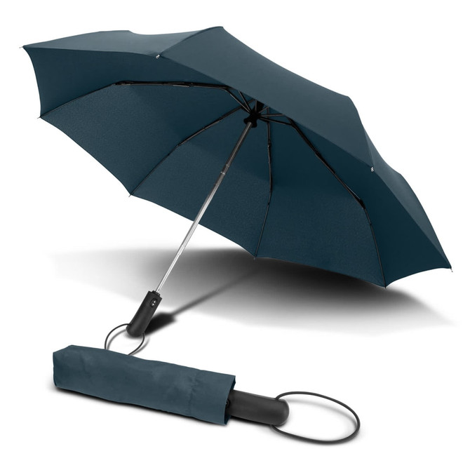 A compact teal umbrella with a black handle, resting next to its matching protective sleeve.