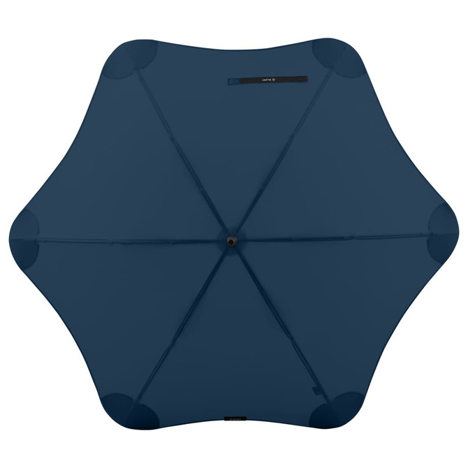 A dark blue BLUNT Classic Umbrella with a unique star-shaped canopy design and a central opening.