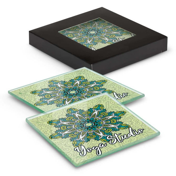A set of two square glass coasters in green with a floral design, packaged in a black box.