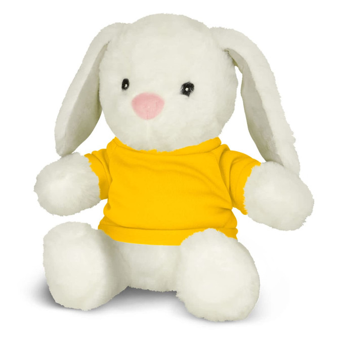A soft, white rabbit plush toy, wearing a bright yellow shirt, sitting upright with floppy ears.