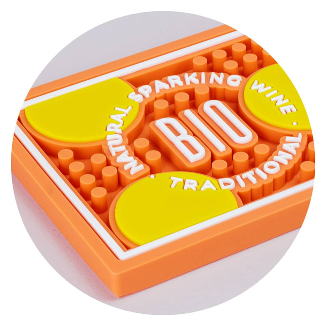 A PVC bar runner featuring orange and yellow colours with circular pads and a textured surface. It has a logo.