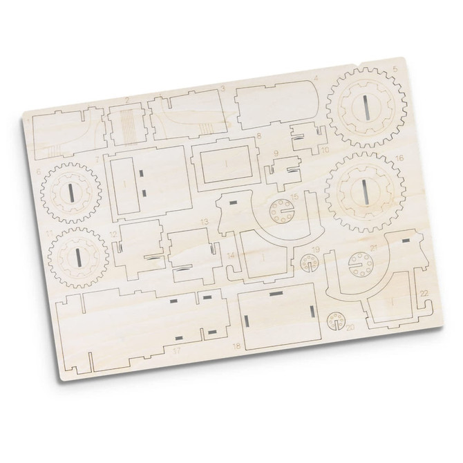 A wooden model kit featuring laser-cut components including gears and various structures, ready for assembly.