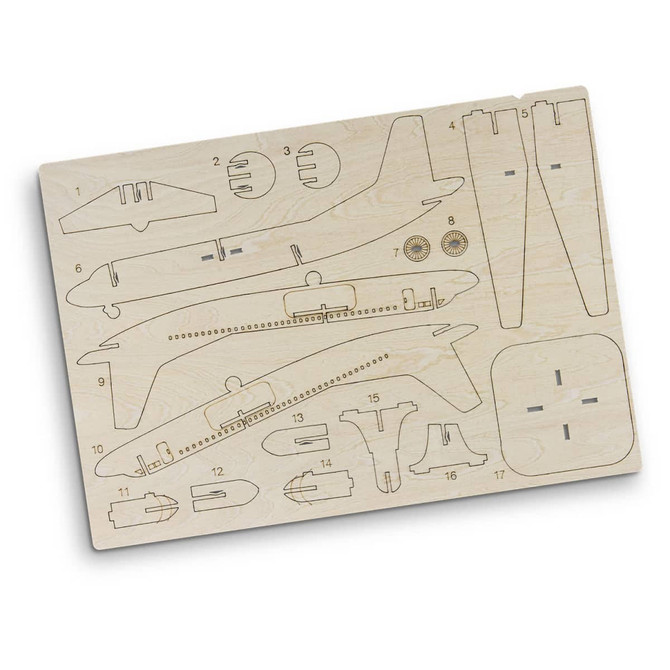 A wooden model kit of a jet plane featuring various parts arranged on a light wood board, including wings and fuselage sections.