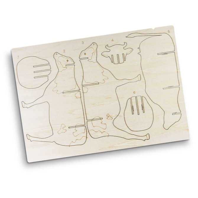 A wooden model kit featuring components to assemble a cow, with engraved outlines for easy assembly.