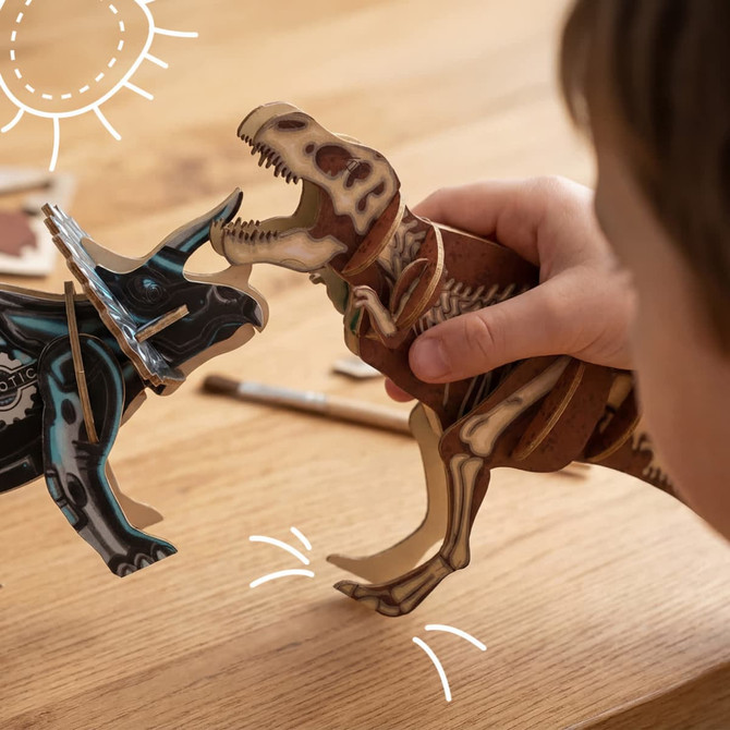A wooden Tyrannosaurus Rex model in brown, engaged in play with a blue dinosaur model on a wooden surface.