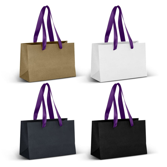 A set of small ribbon handle paper bags in gold, white, and black with purple handles. Each bag has a logo.
