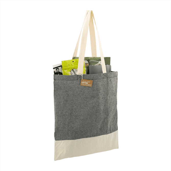 A grey and cream tote bag with a natural fabric texture, featuring a logo and items inside.