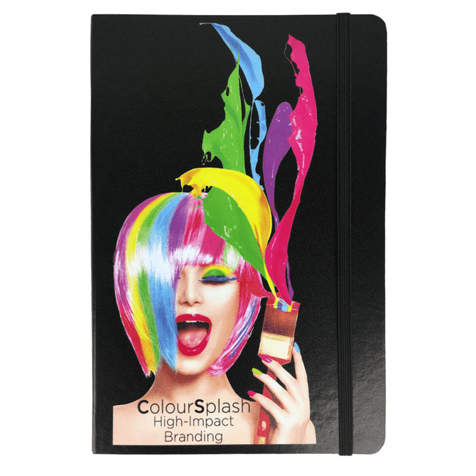 A black notebook with a colourful, artistic design featuring a vibrant wig and paint splashes. There is a logo on the cover.