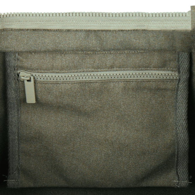 A zipped pocket inside a grey tote bag, featuring a textured fabric design. The bag has a simple, modern look.