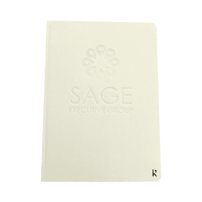 A hardcover notebook in cream colour with an embossed logo on the front cover.