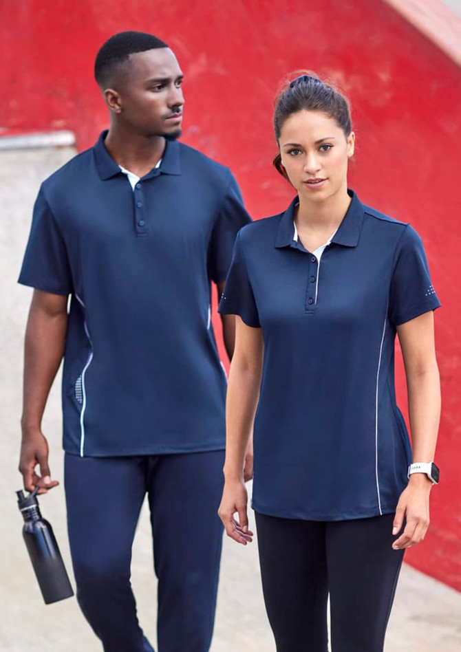 A navy blue short sleeve polo shirt with white accents and a logo, modelled by a man and a woman.