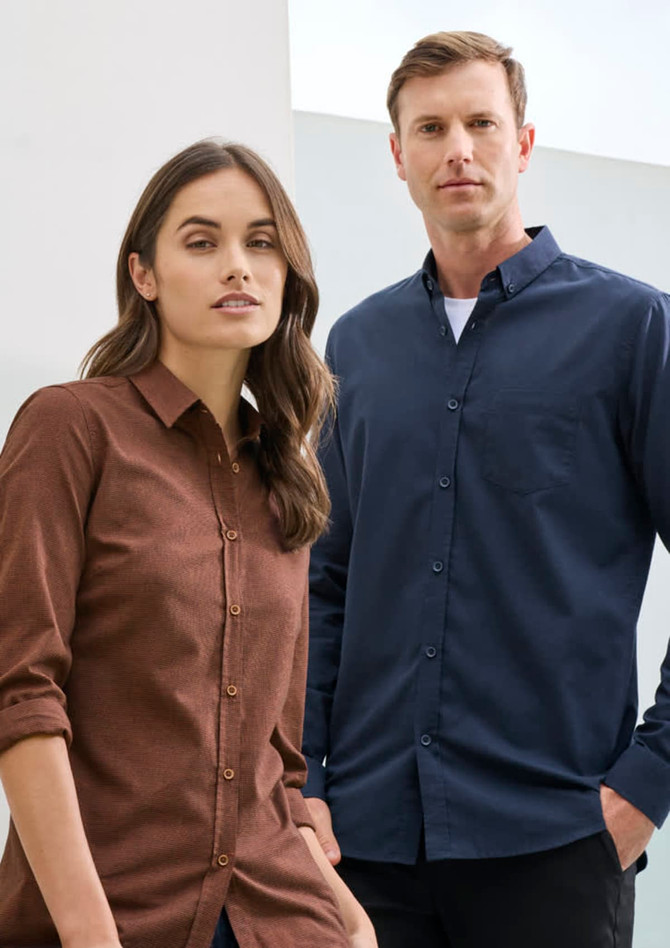 A brown long sleeve button-up shirt for women, paired with a blue button-up shirt for men, both featuring a logo.