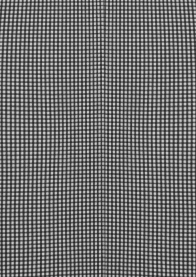 A black and white checkered long sleeve button-up shirt with a subtle pattern and a branded label.