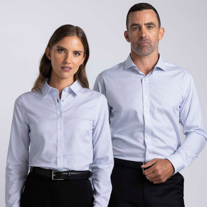 A men's and a women's button-up shirt in light blue check pattern, featuring collars and a logo.