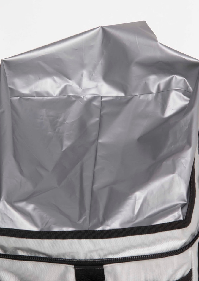 A grey insulated cooler bag with a zip closure and a waterproof interior liner. It features a black trim and handle.