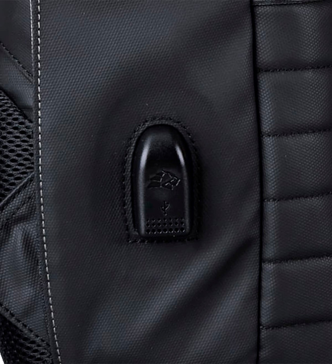 A close-up of a black backpack featuring a sleek, textured design and a small logo on the surface.