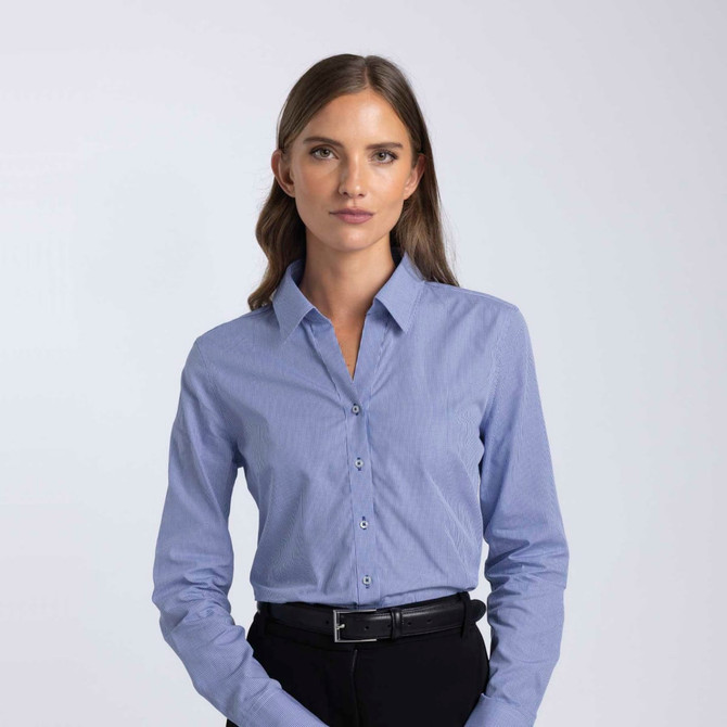 A button-up women's shirt in light blue with a collar and long sleeves, featuring a logo.