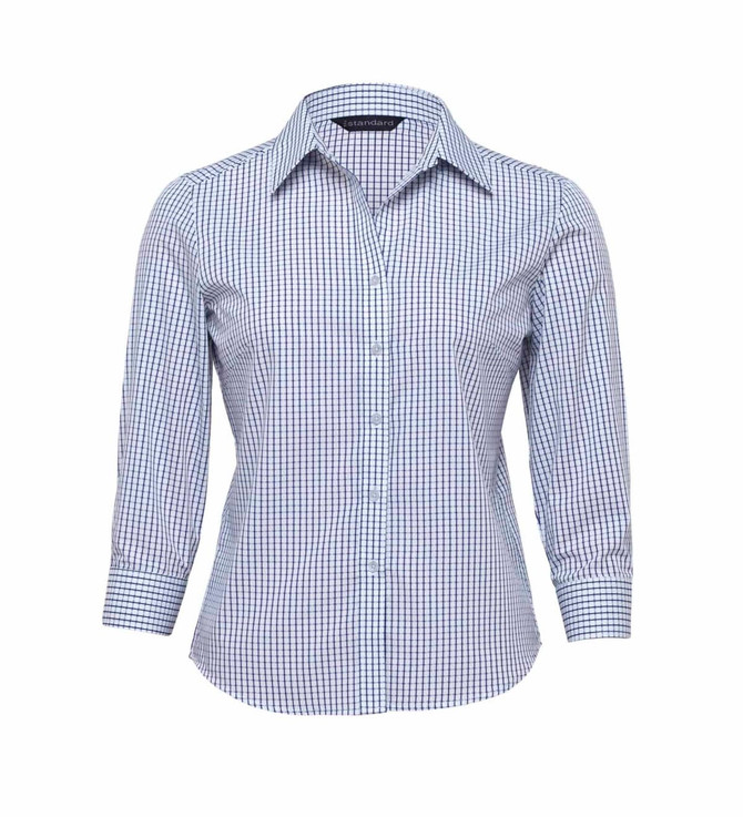 A women's button-up shirt in a blue and white check pattern with long sleeves and a collar. It features a logo.