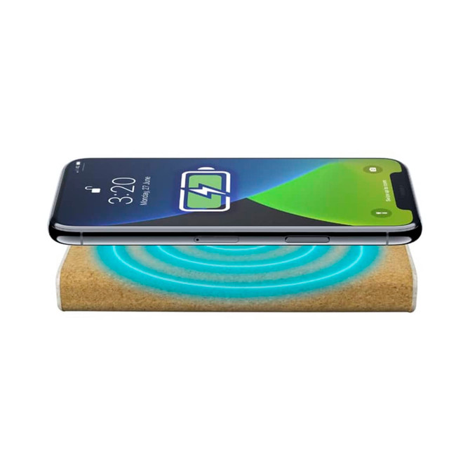 A wireless power bank with a natural finish, displaying a smartphone charging on top. It has a logo visible.