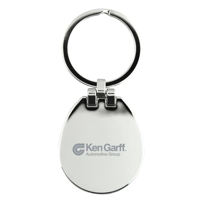 A silver keychain with a circular ring and an egg-shaped body, featuring a logo on one side.