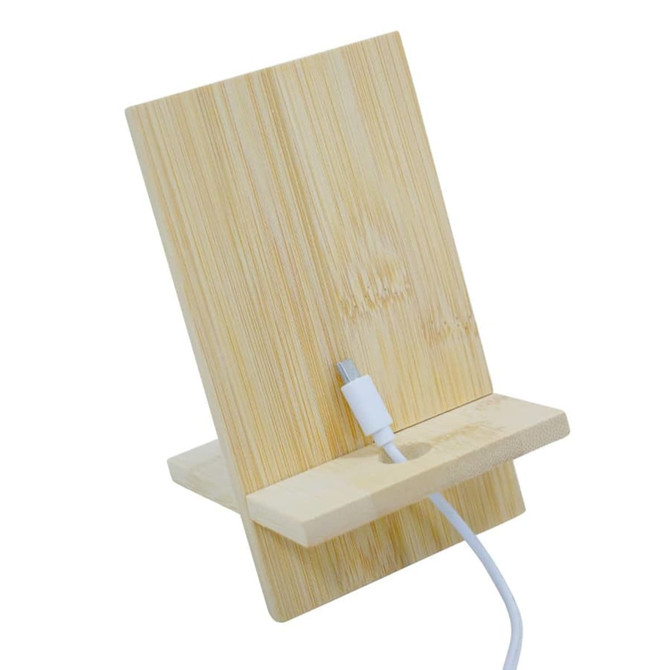 A bamboo phone stand with a slot for charging, featuring a natural wood finish and clean design.