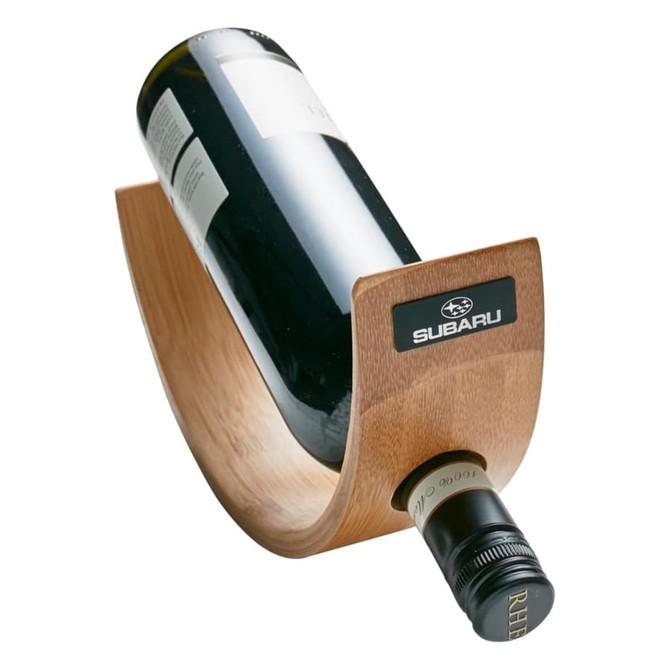 A wine bottle holder in a curved bamboo design, featuring a logo, holding a dark glass wine bottle.